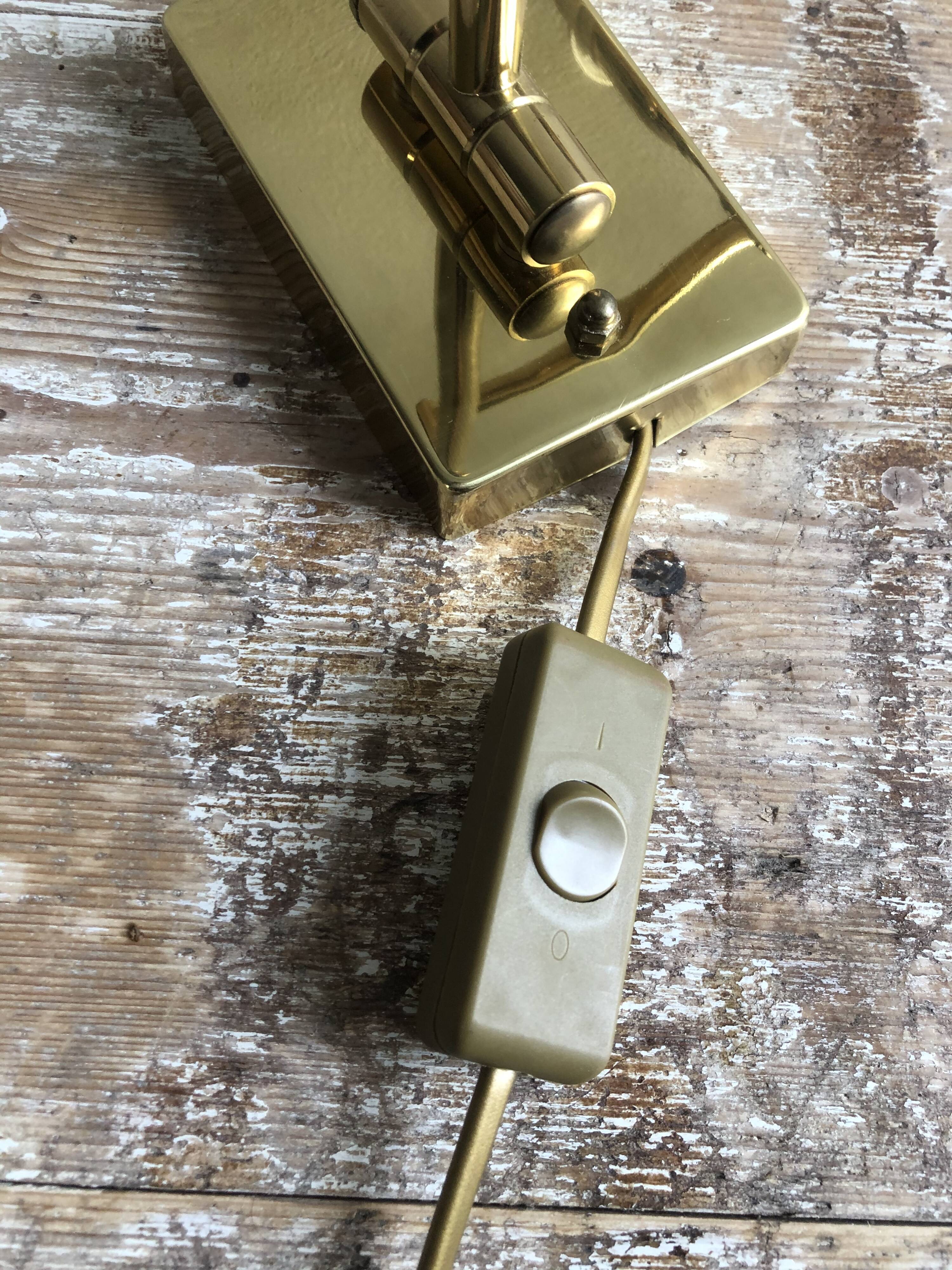 Deschuytener brass articulated wall lamp