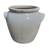 Old pot in beige sandstone.