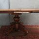 English oval table with 19th century mahogany extensions