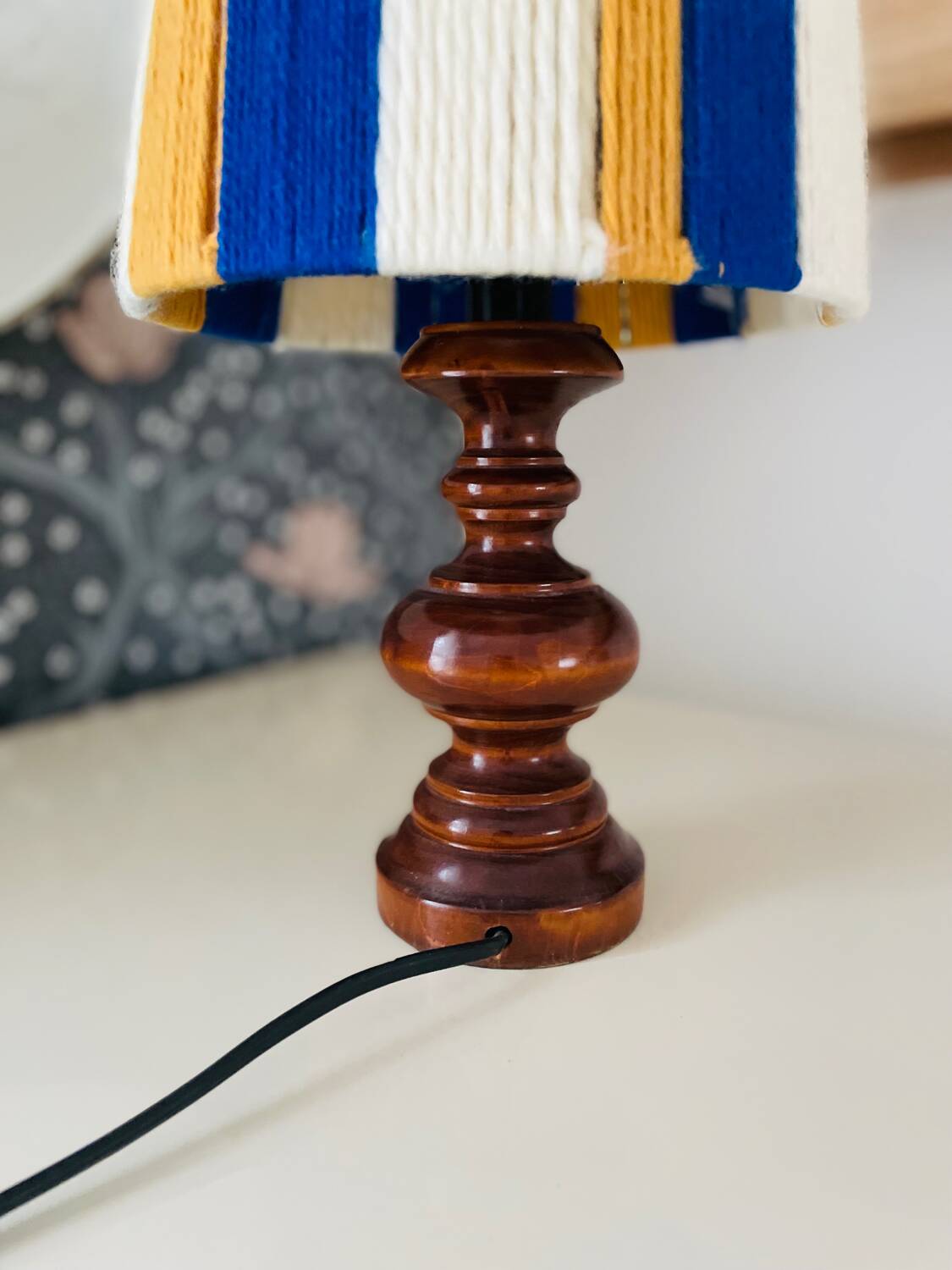 Vintage lamp with turned wooden base, striped wool lampshade