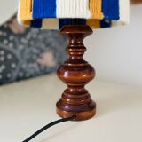Vintage lamp with turned wooden base, striped wool lampshade