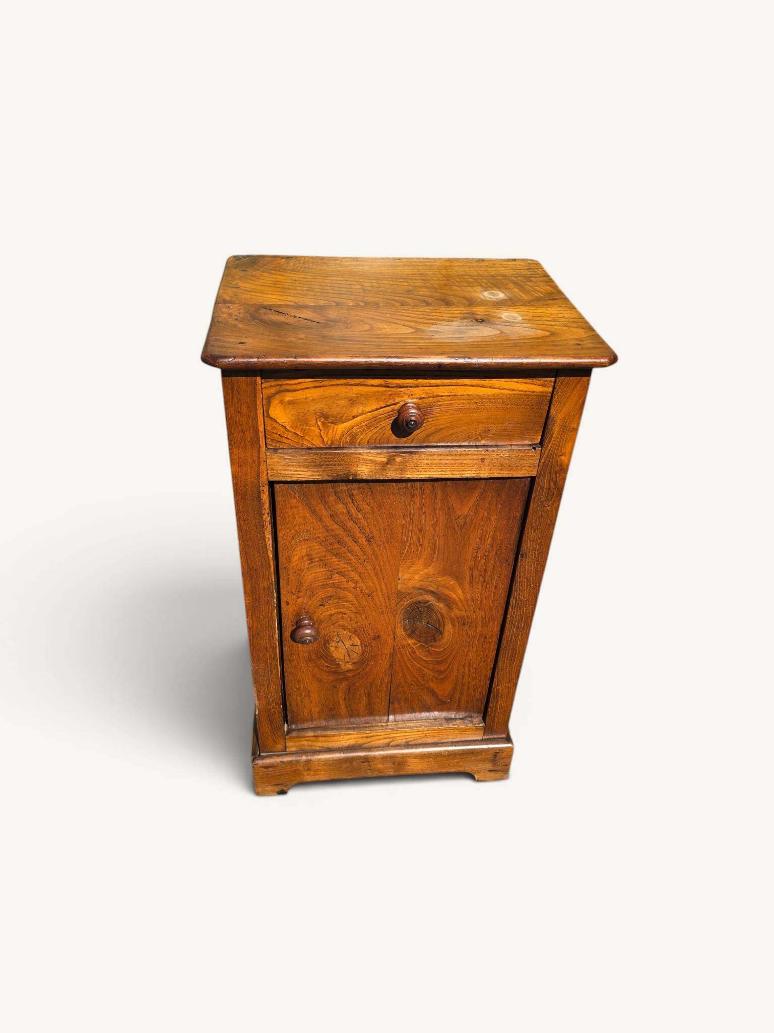 Small rustic antique bedside table made of solid wood.