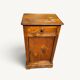 Small rustic antique bedside table made of solid wood.