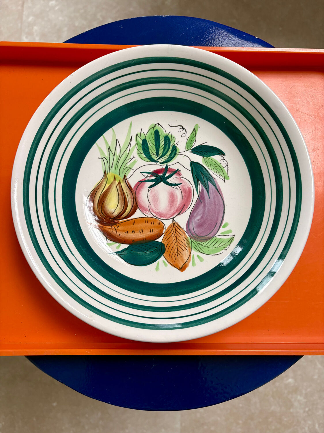 Vintage deep plate with vegetable decoration.
