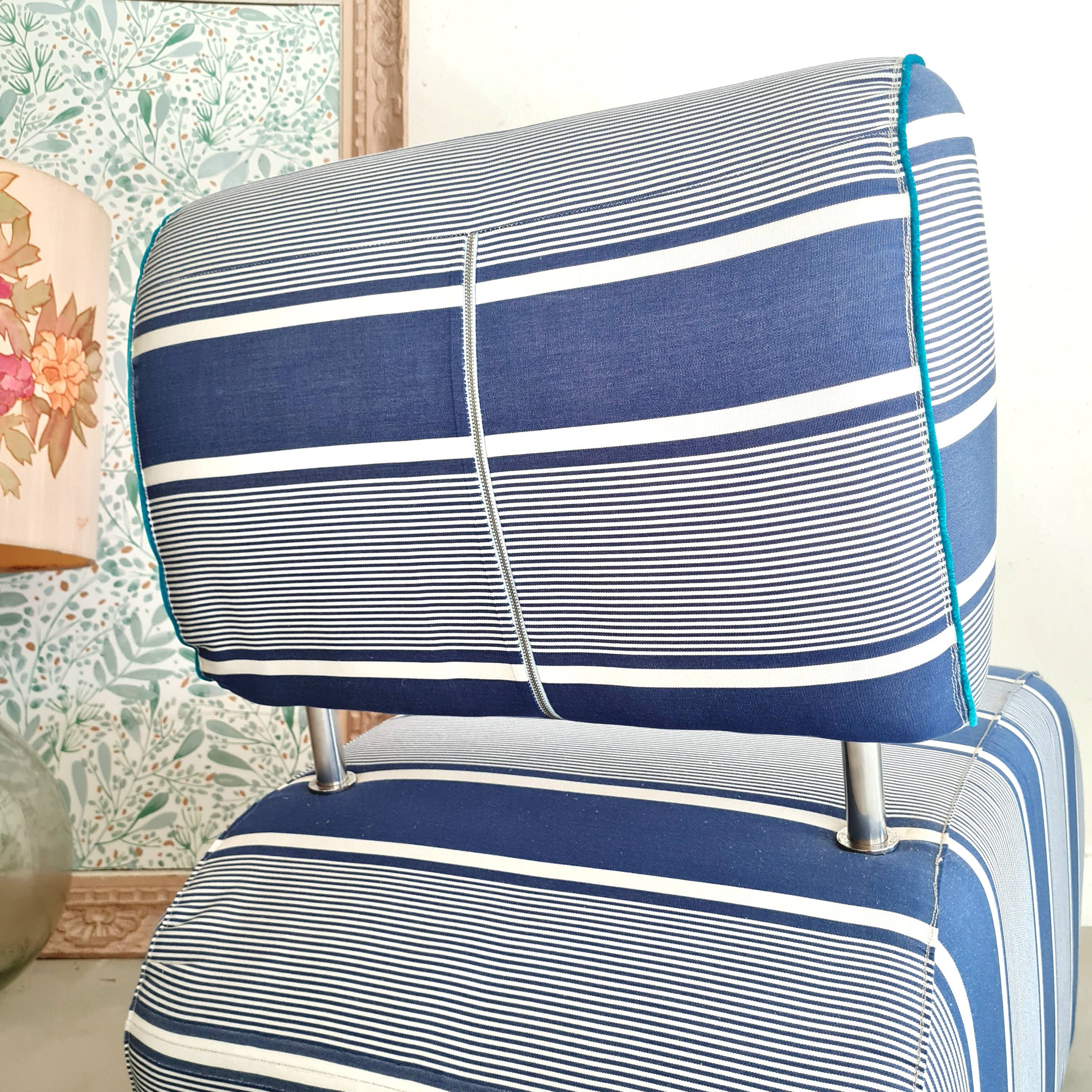 Curved armchair with blue and white stripes