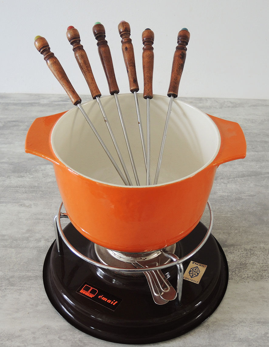 Nomar fondue service in orange cast iron