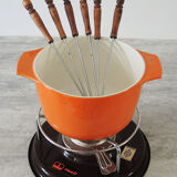 Nomar fondue service in orange cast iron