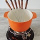 Nomar fondue service in orange cast iron