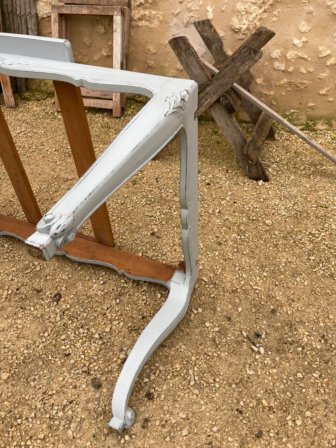 Louis XV style walnut table with a natural wood top.