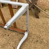 Louis XV style walnut table with a natural wood top.