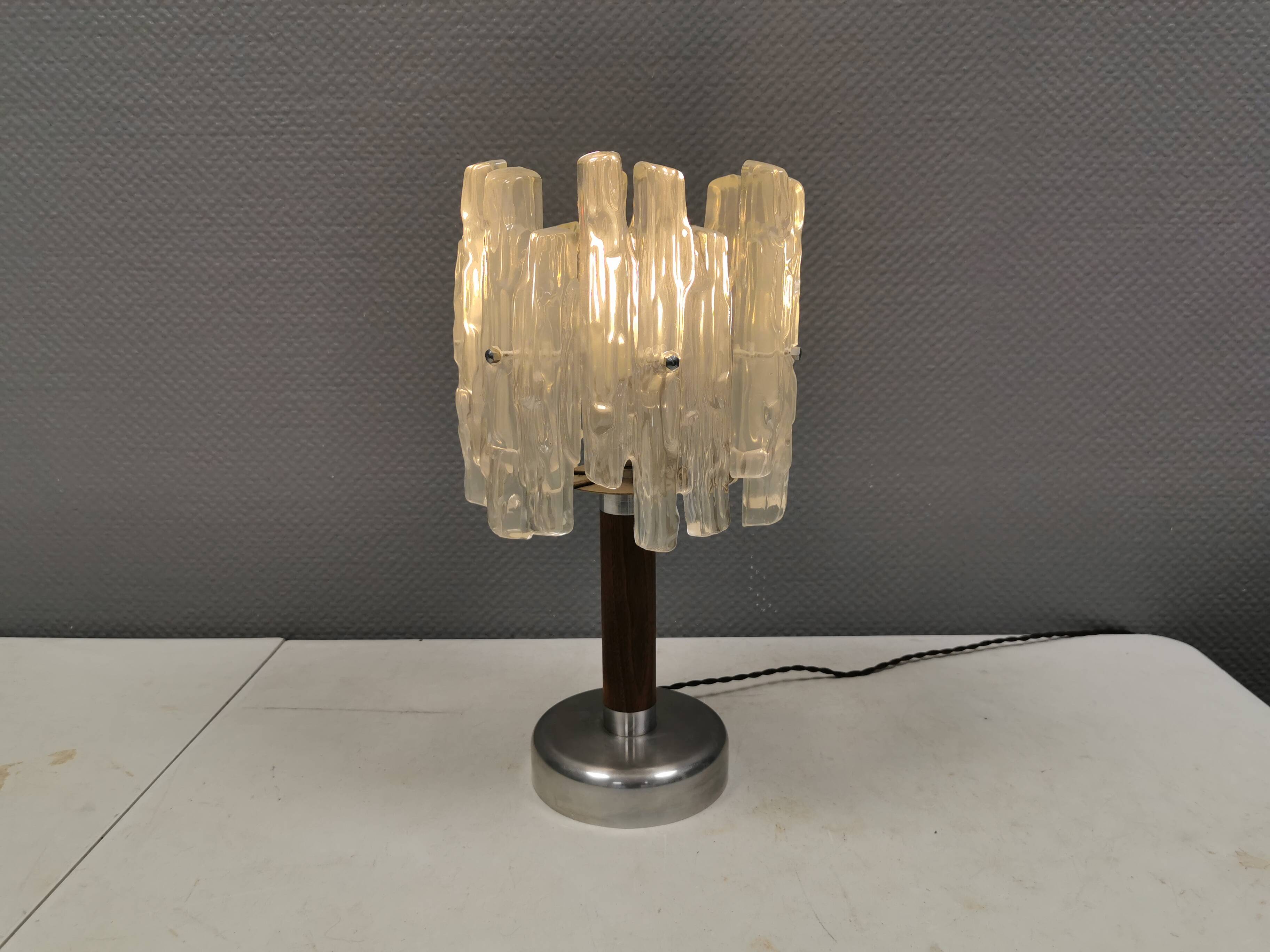 Table lamp with a teak ‘trunk’, silver-coloured metal base, acrylic shade