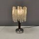 Table lamp with a teak ‘trunk’, silver-coloured metal base, acrylic shade