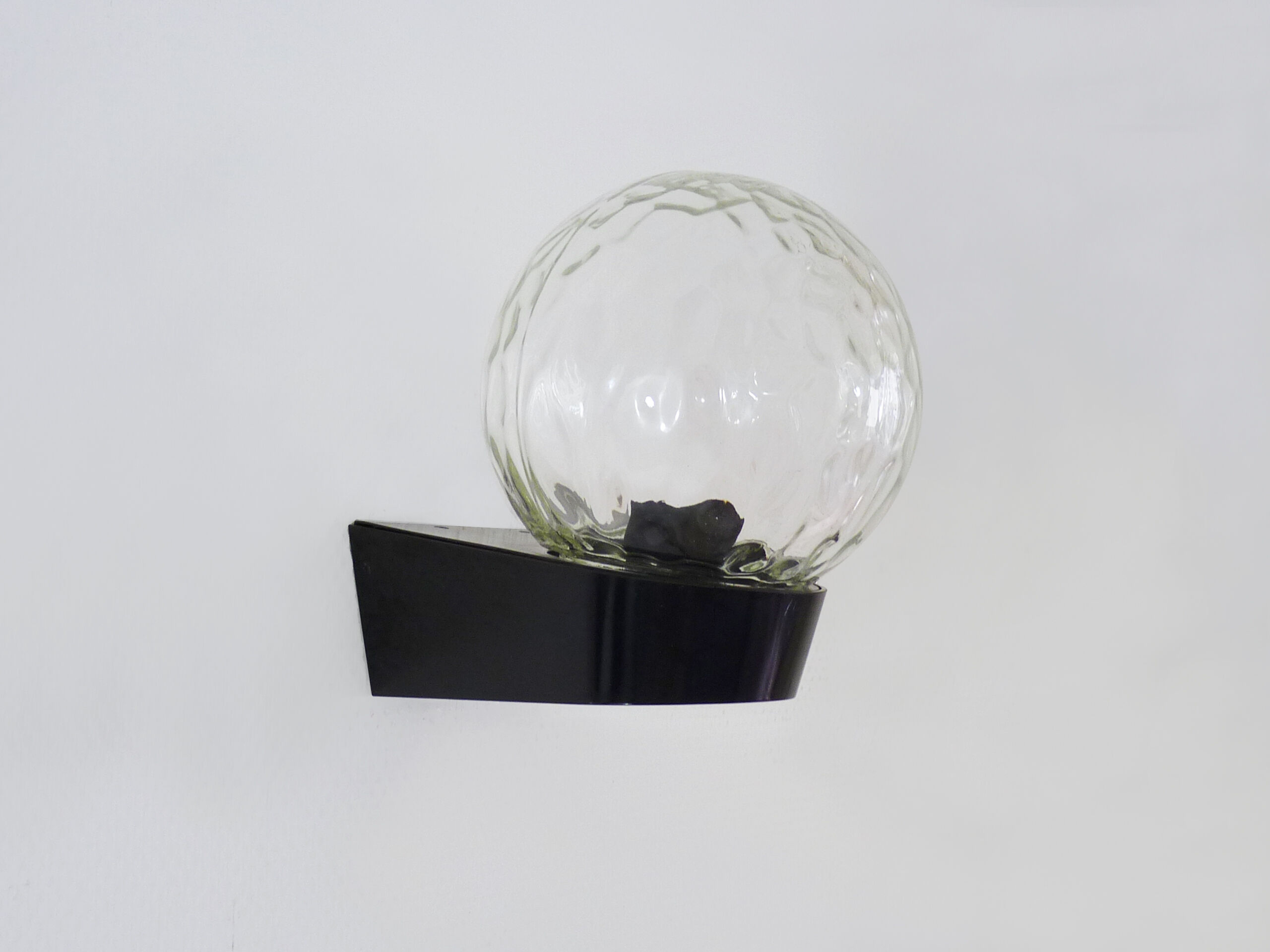 Vintage wall light plastic or bakelite structure, transparent glass globe. Year 70