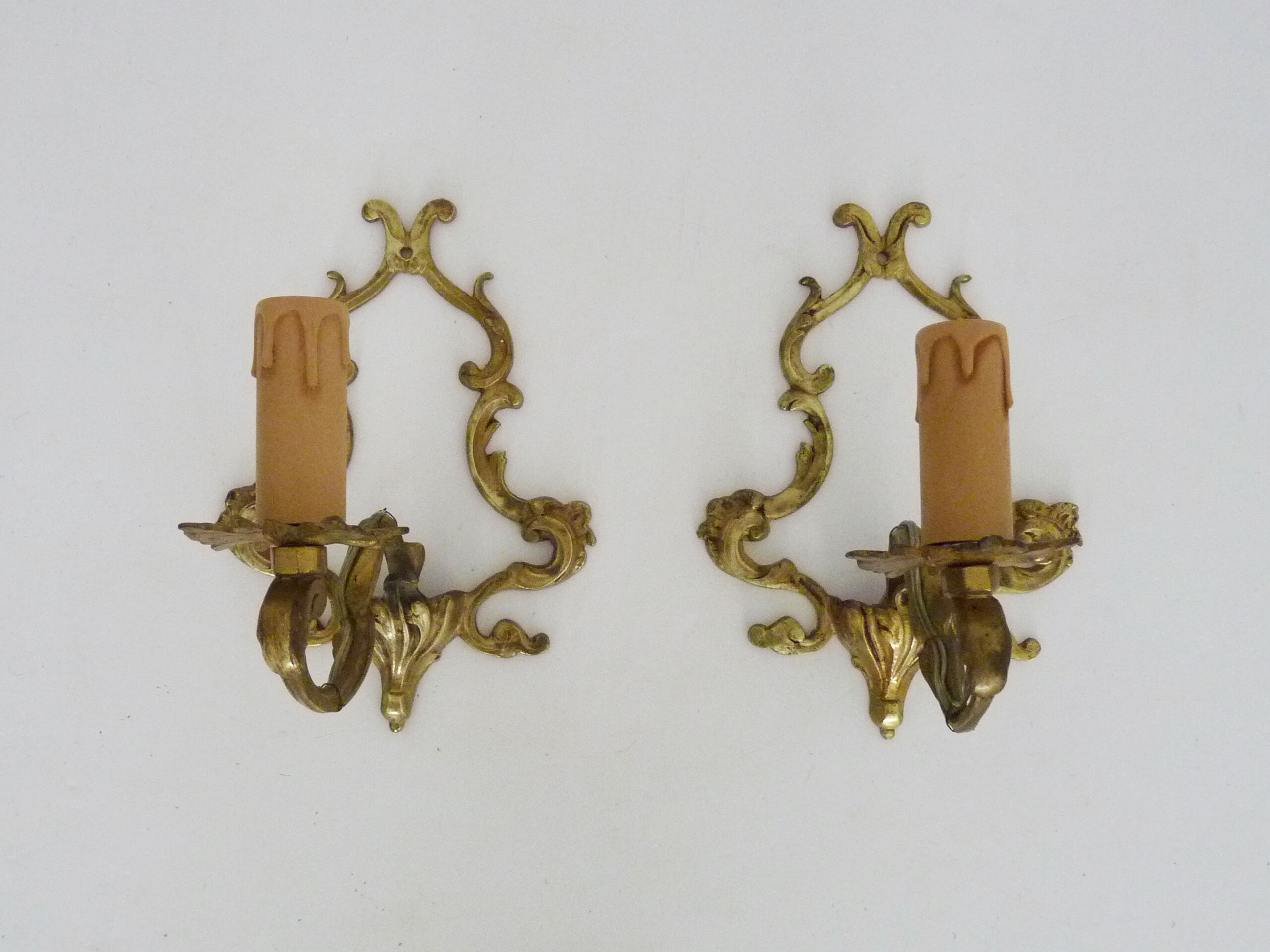 Vintage pair of bronze wall sconces from the 1950s and 60s.