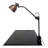 Industrial in height to be adjusted vintage clamp lamp from the 1970s