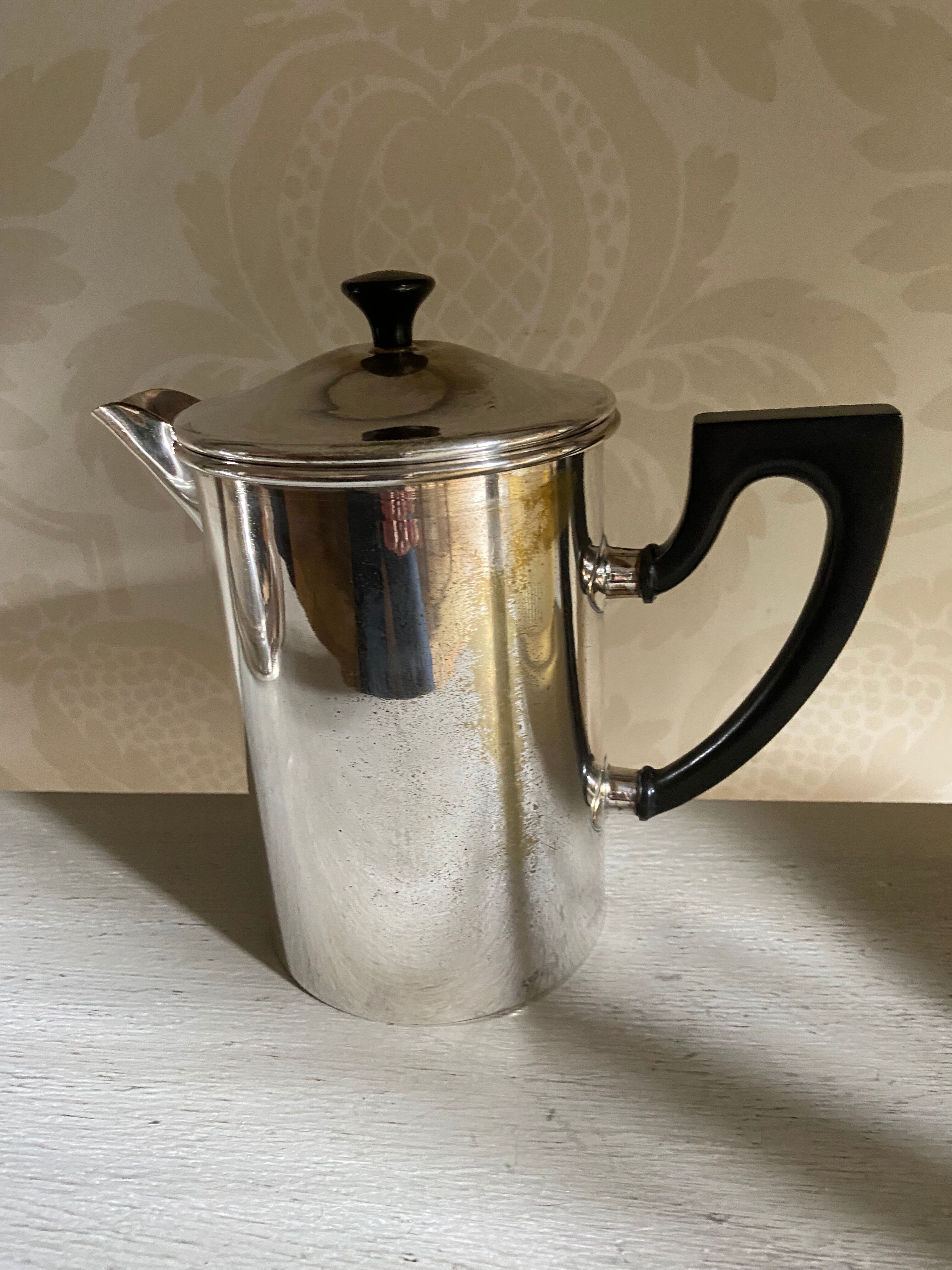 Old silver metal piston coffee maker