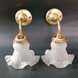 Brass and frosted glass wall lights