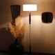 Vintage floor lamp in teak and brass with a cream shade.