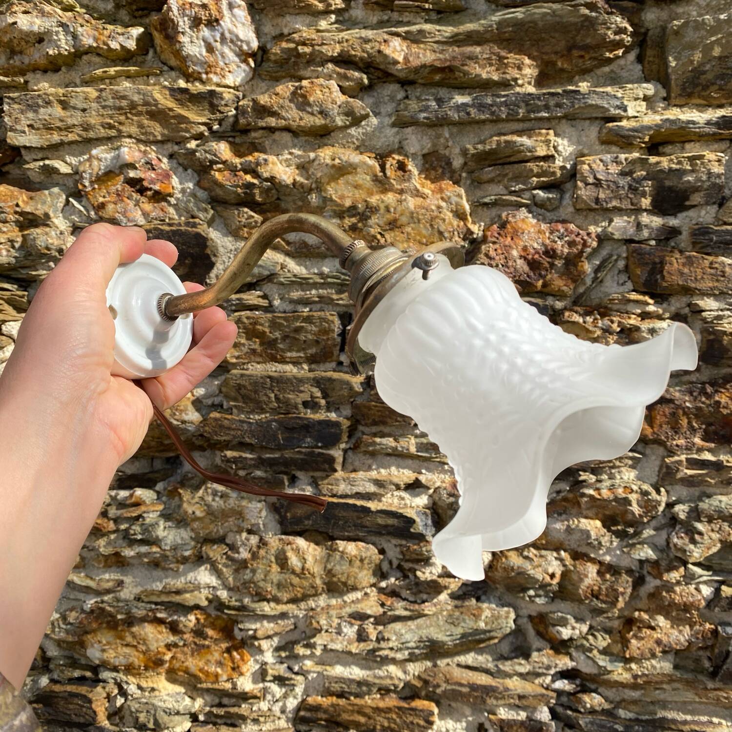 Antique brass and porcelain swan neck wall light.