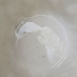 Important white earthenware pot cache with leafy decoration