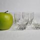 Set of four Art Deco style engraved crystal glasses on spherical feet