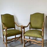 Olive green upholstered armchairs with studs