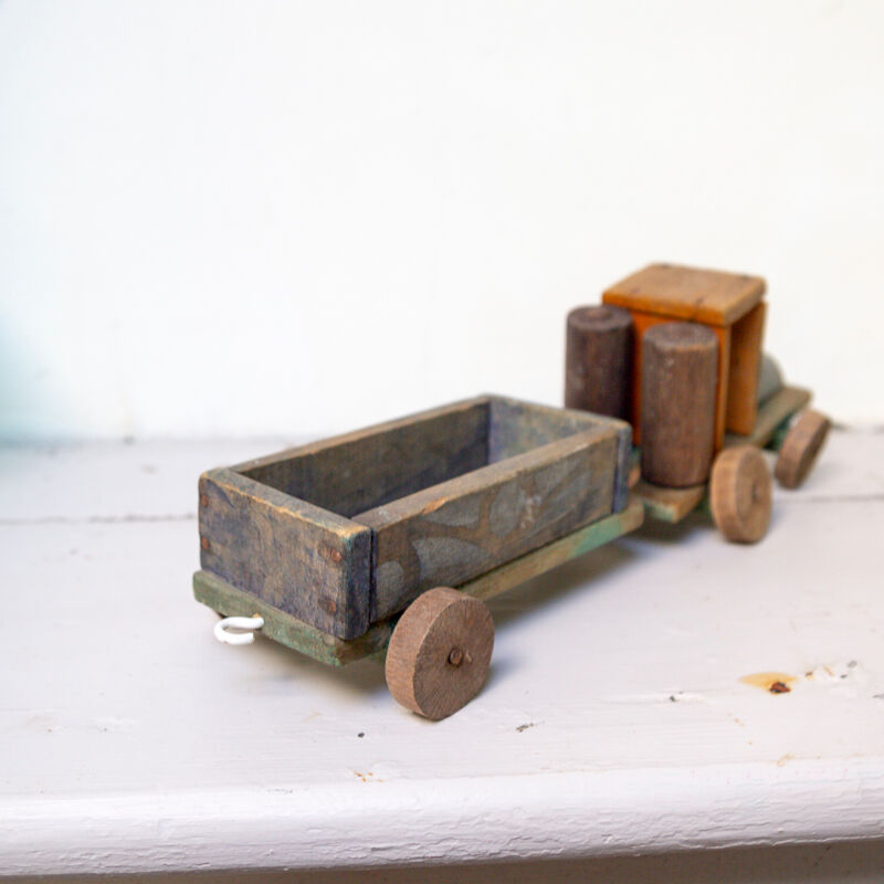 Old wooden train locomotive and toy trailer