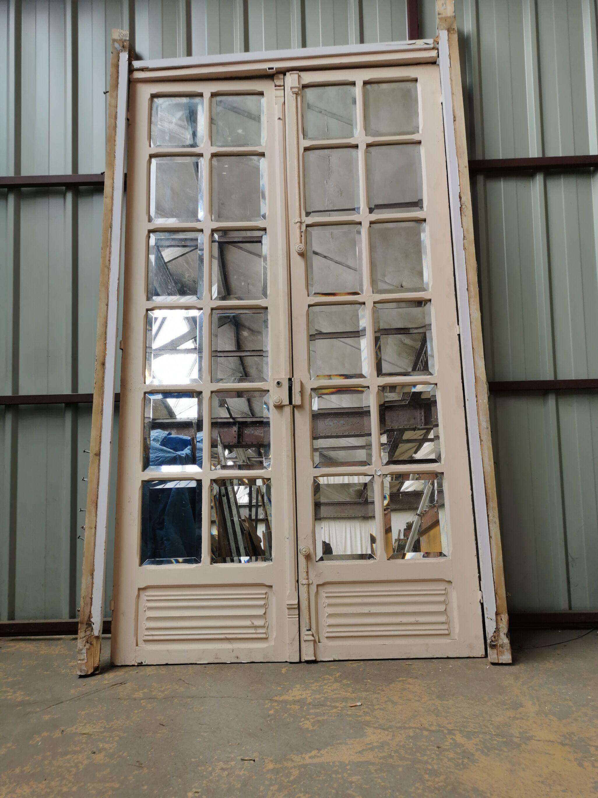 Pair of old haussmannian doors with bevelled mirrors