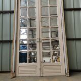 Pair of old haussmannian doors with bevelled mirrors