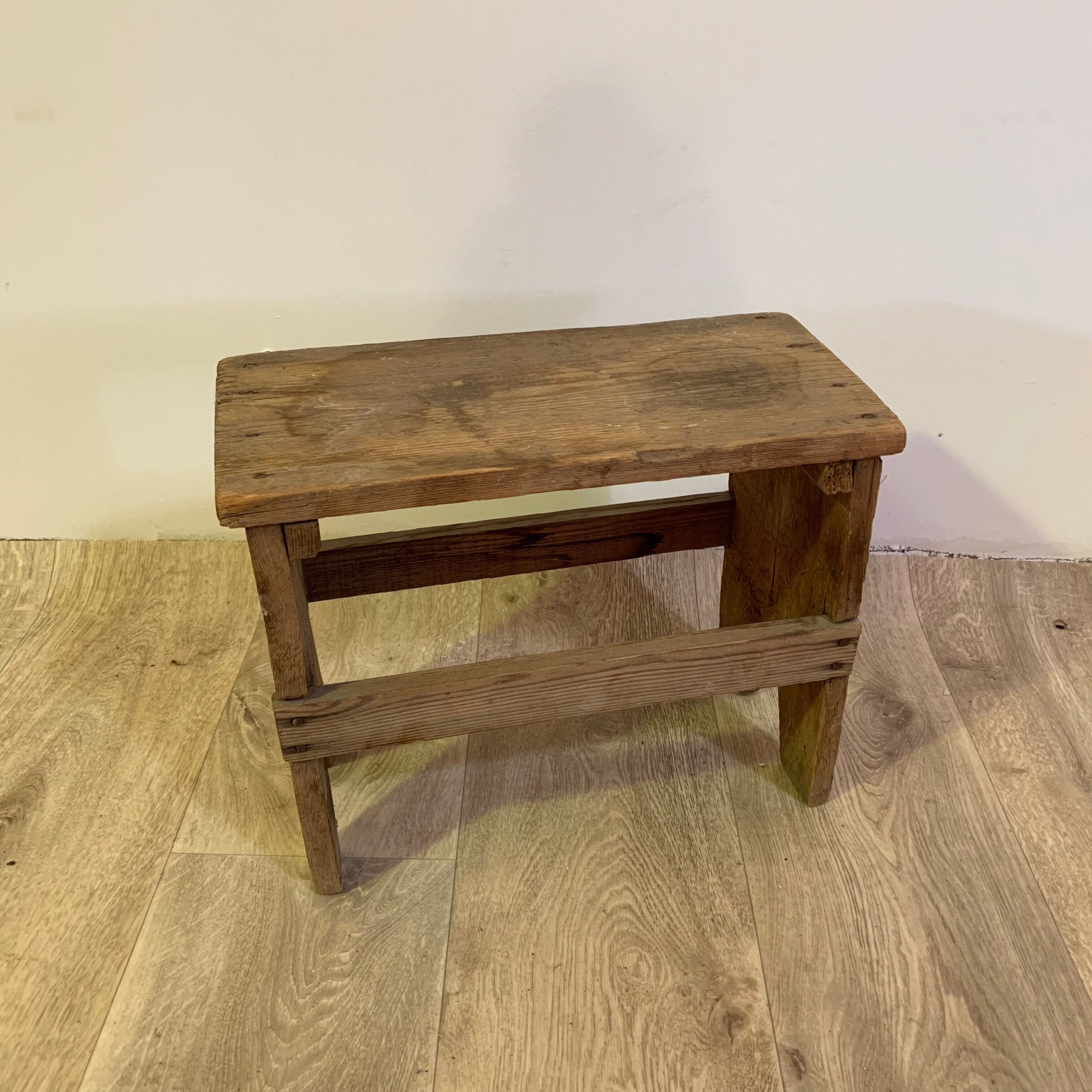Old wooden foot foot stool