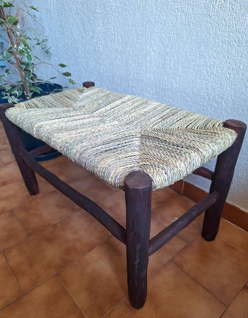 Moroccan bench in dark wood with woven palm leaf seat