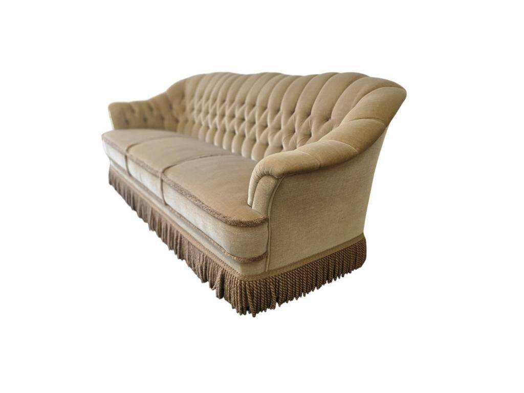 Canapé vintage beige avec franges