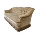 Canapé vintage beige avec franges
