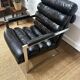 Vintage 1970s black leather armchair – metal frame