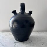Black water jug with floral decoration