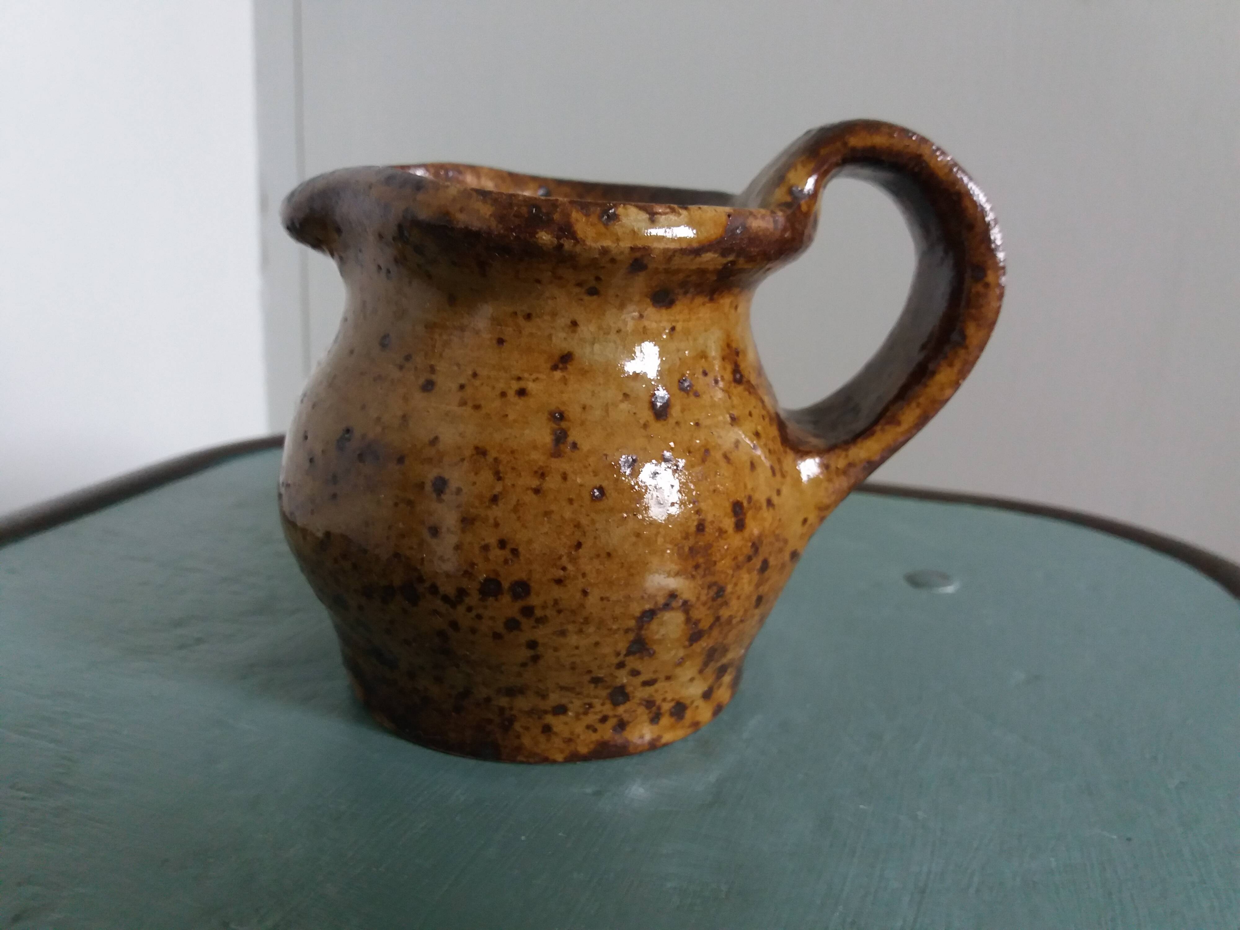Stoneware pitcher signed cg