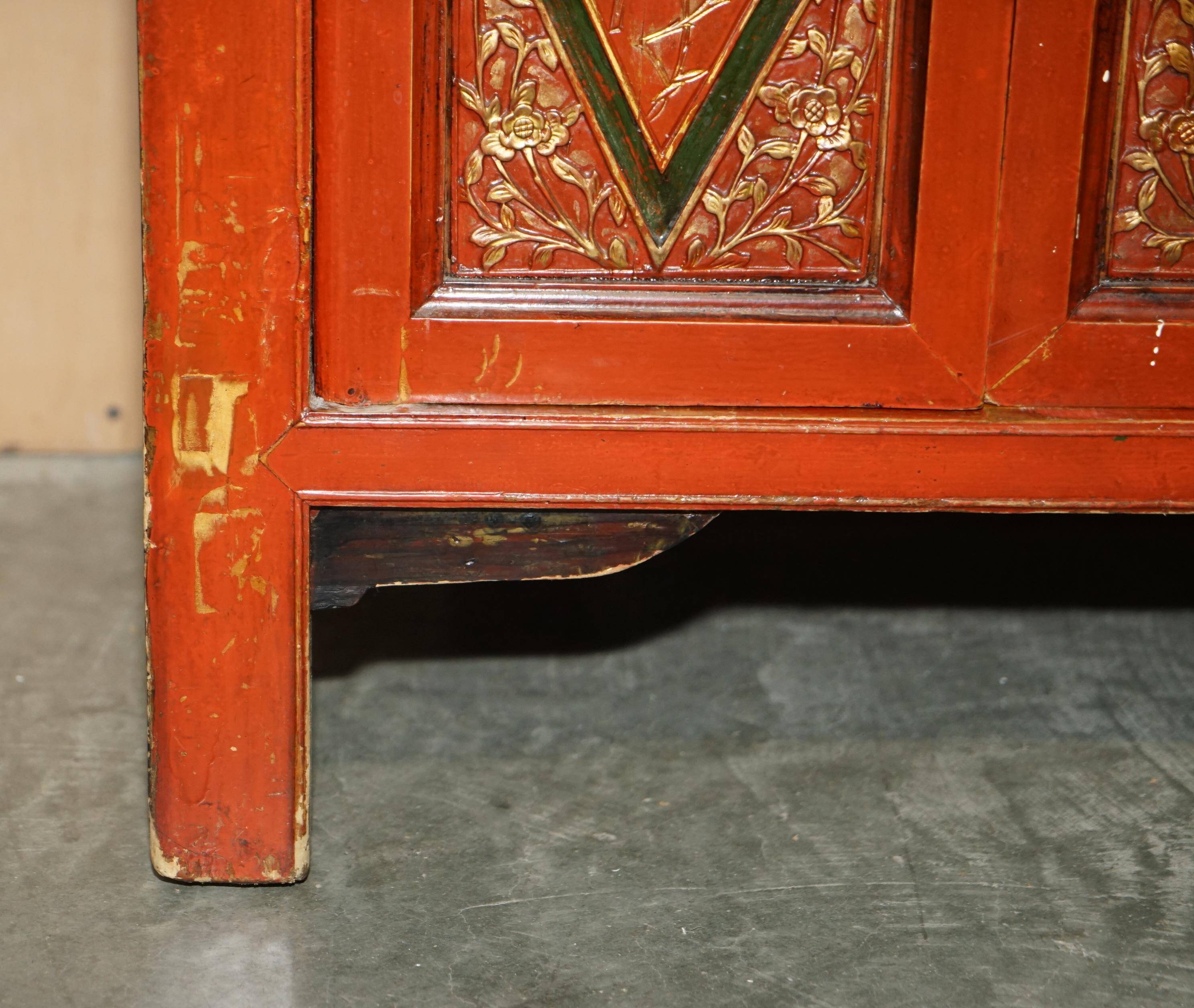 Vintage Chinese lacquered buffet decorated with gold leaf.
