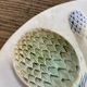 Plate with asparagus and artichokes in splash of Luneville