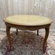 Round oak dining table with leather in Louis XV style.
