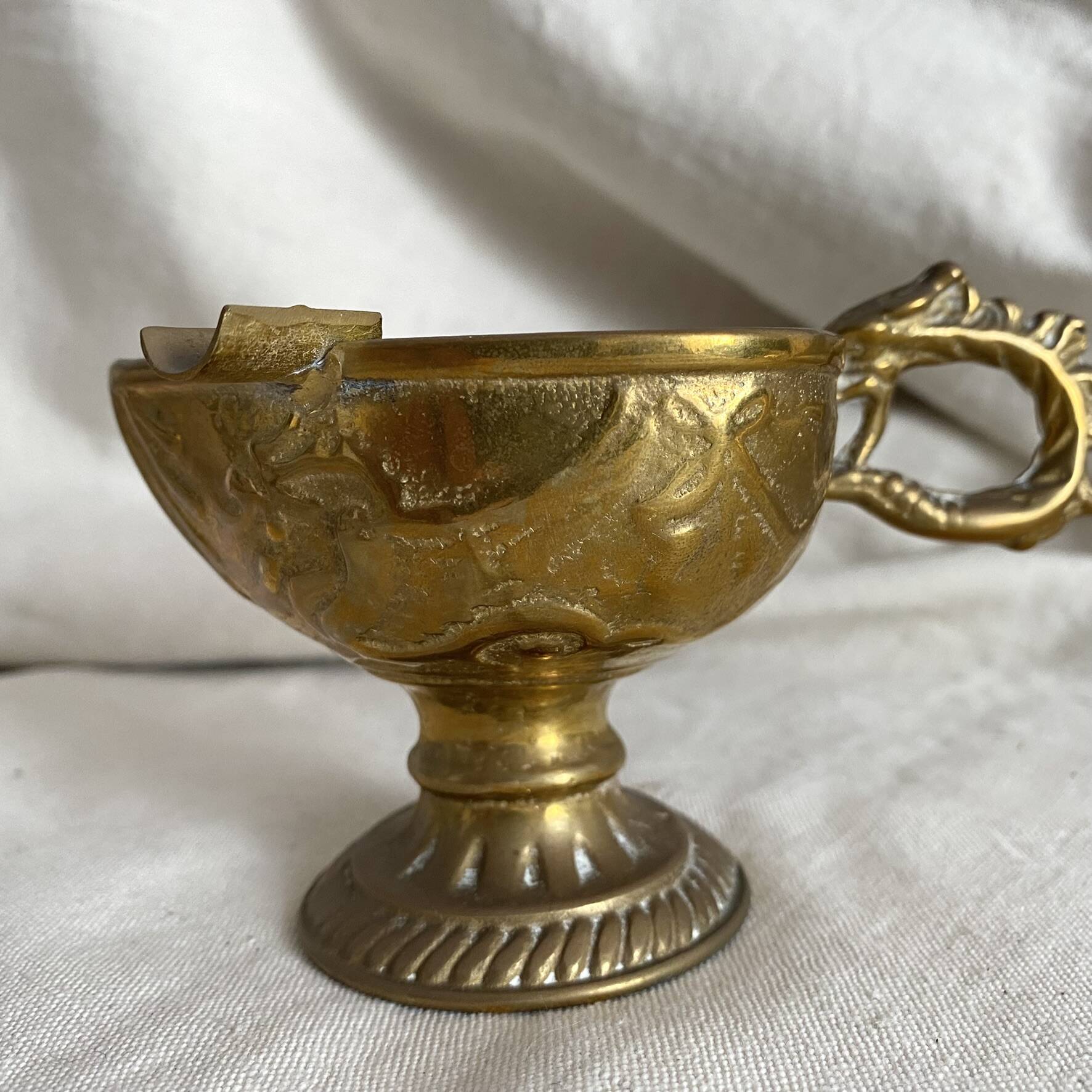 Antique embossed brass ashtray