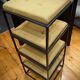Table basse noire en métal mat et 4 tabourets encastrables