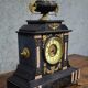 Large notary clock in black marble and gilded bronze.