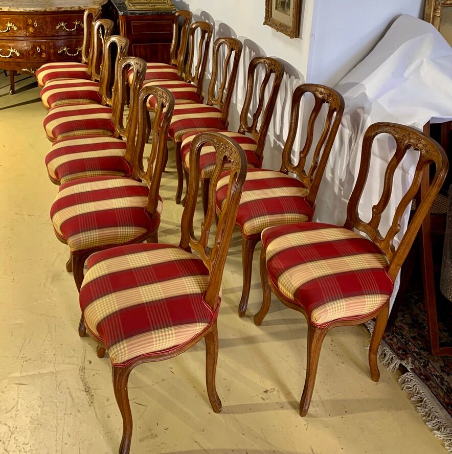 12 chairs in oak, carved wood with fleurette decorations, fabric seat