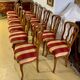 12 chairs in oak, carved wood with fleurette decorations, fabric seat
