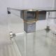 Coffee table in plexiglass, brass and glass top, 1980.