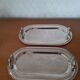 Two foie gras dishes and their toast holder