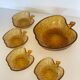 Amber glass dessert service in the shape of an apple made in Italy.