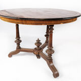 Round dining table of walnut with inlaid wood, 1890s