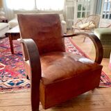 Vintage leather club chair with wooden armrests