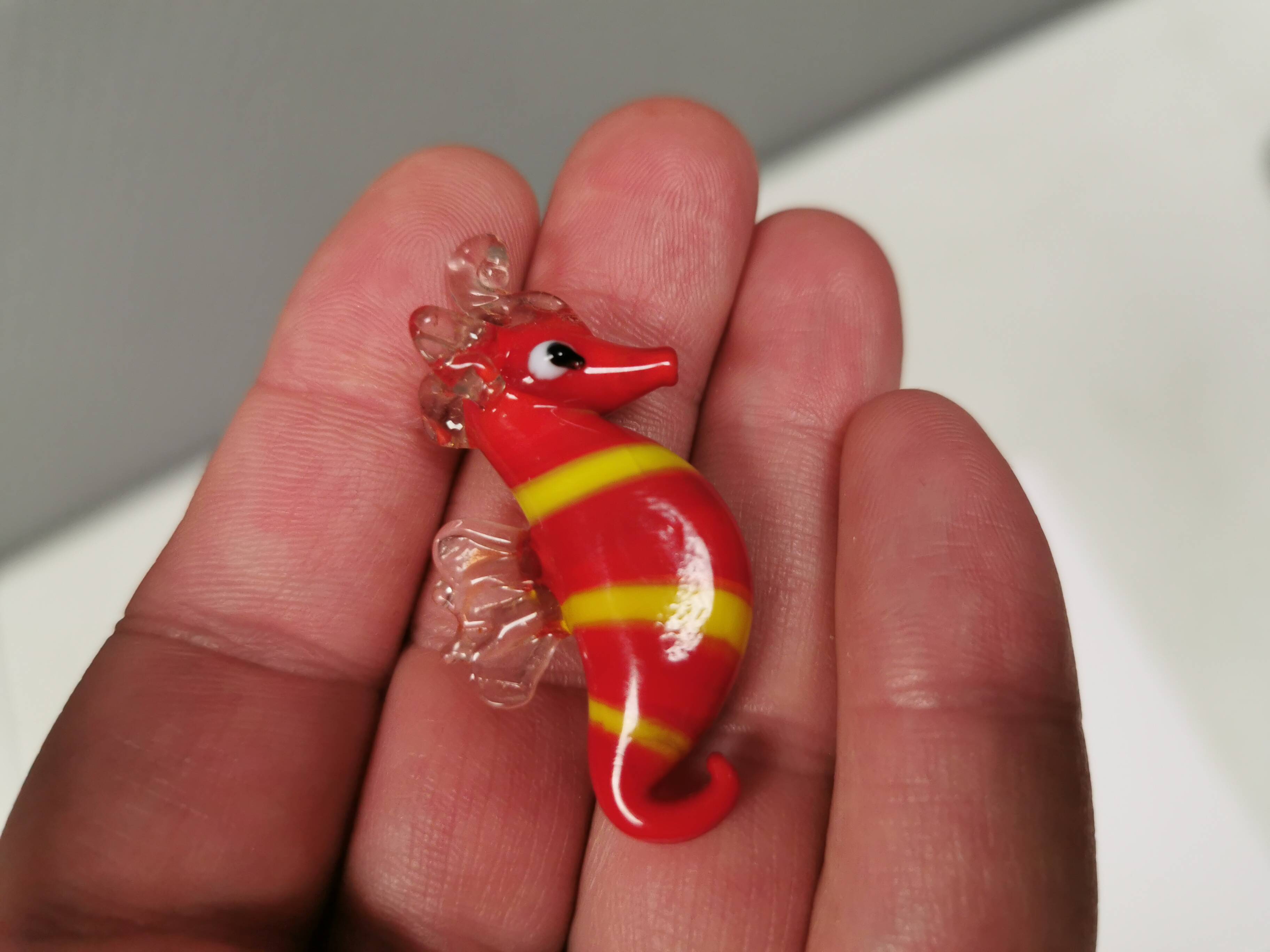 Six small Murano Seahorses in glass.